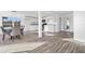 Open kitchen and dining area with white cabinets and modern appliances at 221 Duxbury Ave, Port Charlotte, FL 33952