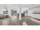 Open living and dining area with hardwood floors and plenty of natural light at 221 Duxbury Ave, Port Charlotte, FL 33952