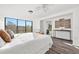 Spacious main bedroom with large windows offering natural light and modern decor at 221 Duxbury Ave, Port Charlotte, FL 33952