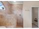 Elegant bathroom featuring a tiled walk-in shower with a built-in bench and decorative accents at 251 Dove Trl, Bradenton, FL 34212