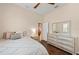 Bedroom featuring a ceiling fan, wood floors, and a bright window offering a peaceful ambiance at 251 Dove Trl, Bradenton, FL 34212