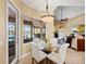 This breakfast nook has great views of the pool and lake at 251 Dove Trl, Bradenton, FL 34212