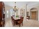 Formal dining room with tile floors, chandelier, and views to the front entry at 251 Dove Trl, Bradenton, FL 34212