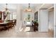 Elegant foyer with tile floors, view of dining room and a charming console table at 251 Dove Trl, Bradenton, FL 34212