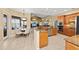 Bright kitchen boasts granite countertops, stainless appliances, and breakfast nook with stunning pool views at 251 Dove Trl, Bradenton, FL 34212