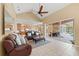 Spacious living room with vaulted ceiling, comfortable seating and views into the kitchen and lanai at 251 Dove Trl, Bradenton, FL 34212