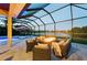 Outdoor living space with fire pit, comfortable seating and lake views at 251 Dove Trl, Bradenton, FL 34212