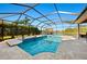 Screened pool with jacuzzi and lounge chairs with view of the lake at 251 Dove Trl, Bradenton, FL 34212