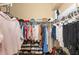 Walk-in closet with dual hanging racks, built in shoe storage, and room for luggage at 251 Dove Trl, Bradenton, FL 34212