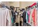 Spacious walk-in closet with ample storage, multiple hanging racks, and handbag storage at 251 Dove Trl, Bradenton, FL 34212