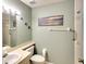 Cozy bathroom with stylish accents and a framed beach picture at 2608 Waterford Way # B, Palmetto, FL 34221