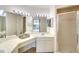 Bright bathroom featuring double sinks, vanity with lighting, and mirrors that enhance the space at 2608 Waterford Way # B, Palmetto, FL 34221