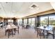 Bright dining area with plenty of tables and chairs, brick accents and large windows with scenic views at 2608 Waterford Way # B, Palmetto, FL 34221