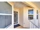 The entrance of the condo features security door, large window and classic tan stucco at 2608 Waterford Way # B, Palmetto, FL 34221