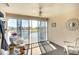 Sunroom with golf course views from sliding glass doors at 2608 Waterford Way # B, Palmetto, FL 34221