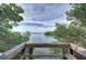 Picturesque view of the open water framed by lush green trees and foliage at 2608 Waterford Way # B, Palmetto, FL 34221