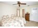 Cozy bedroom featuring two beds, ceiling fan, and ample closet space at 2614 67Th W St, Bradenton, FL 34209