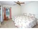 Cozy bedroom featuring twin beds, a ceiling fan, and a rocking chair near the window at 2614 67Th W St, Bradenton, FL 34209