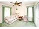 Cozy bedroom featuring a twin bed, ceiling fan, and green accents for a comfortable and relaxing space at 2614 67Th W St, Bradenton, FL 34209