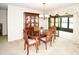 Formal dining room featuring a wood table and chairs, a china cabinet, and lots of natural light at 2614 67Th W St, Bradenton, FL 34209