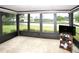 Bright sunroom with large windows offering panoramic views of the surrounding neighborhood at 2614 67Th W St, Bradenton, FL 34209