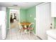 Eat-in kitchen offering tile floors and a view to the living and dining room areas at 2614 67Th W St, Bradenton, FL 34209