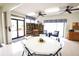 Bright and open meeting space with tables, chairs, and a bookshelf filled with many books at 2614 67Th W St, Bradenton, FL 34209