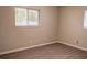 Bedroom featuring wood-look flooring, a large window with natural light, and neutral walls at 2722 Nancy St, Sarasota, FL 34237