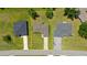 Aerial view of a single Gathering home showing the roof and driveway and adjacent street at 27255 Deep Creek Blvd, Punta Gorda, FL 33983
