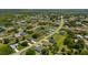 Overhead shot showcasing a community with water views, surrounded by beautiful landscaping and charming streets at 27255 Deep Creek Blvd, Punta Gorda, FL 33983