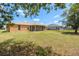 Well-maintained backyard featuring a screened-in patio, offering a serene outdoor space at 27255 Deep Creek Blvd, Punta Gorda, FL 33983