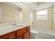 Bathroom with marble countertop, neutral tone, vanity, toilet, and shower-tub combination at 27255 Deep Creek Blvd, Punta Gorda, FL 33983