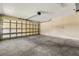 Spacious two-car garage, perfect for parking and storage, with a concrete floor and functional garage door at 27255 Deep Creek Blvd, Punta Gorda, FL 33983