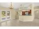 A combined living and kitchen area with tile flooring, granite countertops, and stainless steel appliances at 27255 Deep Creek Blvd, Punta Gorda, FL 33983