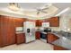 This kitchen features granite countertops, stainless appliances, and wood cabinetry at 27255 Deep Creek Blvd, Punta Gorda, FL 33983