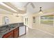 This kitchen features granite countertops, stainless appliances, and wood cabinetry at 27255 Deep Creek Blvd, Punta Gorda, FL 33983