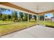 Relaxing screened-in porch with ceiling fan offering views of the lush, landscaped backyard at 27255 Deep Creek Blvd, Punta Gorda, FL 33983