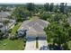 Bird's eye view of a well-maintained home with a two-car garage and lush greenery in a serene neighborhood at 3312 92Nd E Ave, Parrish, FL 34219