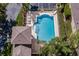 Aerial view of the community pool, complete with chairs, landscaping, and a covered cabana at 3312 92Nd E Ave, Parrish, FL 34219