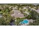 Aerial view of the house, highlighting its landscaping and the community pool at 3312 92Nd E Ave, Parrish, FL 34219