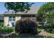 Home's backyard features a bougainvillea, screened patio and manicured lawn at 3312 92Nd E Ave, Parrish, FL 34219