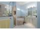 Bathroom features a tub, shower and a vanity with a large mirror at 3312 92Nd E Ave, Parrish, FL 34219
