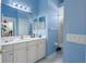 Bright bathroom with a vanity and a doorway to a toilet and shower room creating a functional layout at 3312 92Nd E Ave, Parrish, FL 34219