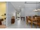 Open floor plan featuring dining area and entryway with tile flooring and neutral color palette at 3312 92Nd E Ave, Parrish, FL 34219