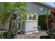 Generac generator on a concrete pad with tropical landscaping, providing reliable backup power at 3312 92Nd E Ave, Parrish, FL 34219
