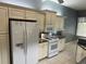 Modern kitchen featuring granite countertops, stainless appliances, and ample cabinet space at 3312 92Nd E Ave, Parrish, FL 34219
