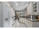 Bright kitchen featuring white cabinets, granite countertops, and stainless steel appliances at 3312 92Nd E Ave, Parrish, FL 34219