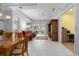 Expansive living space showcasing a dining area, access to the lanai, and seamless flow throughout the home at 3312 92Nd E Ave, Parrish, FL 34219