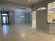 Spacious living area featuring tile flooring, stylish light fixture, and an open layout at 3312 92Nd E Ave, Parrish, FL 34219