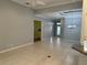 Open-concept living room featuring tile floors, recessed lighting, and an entryway to another room at 3312 92Nd E Ave, Parrish, FL 34219